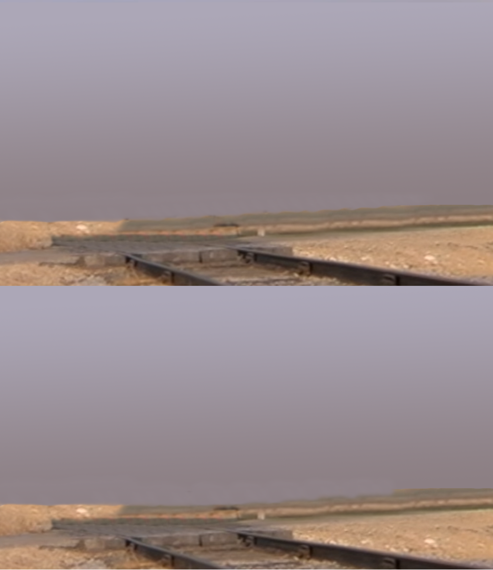 Train tracks empty field